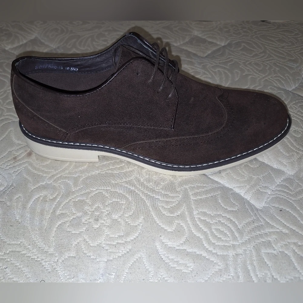 A pair of Franco Vanucci brown suede men's loafers in a size 10.5. EUC.